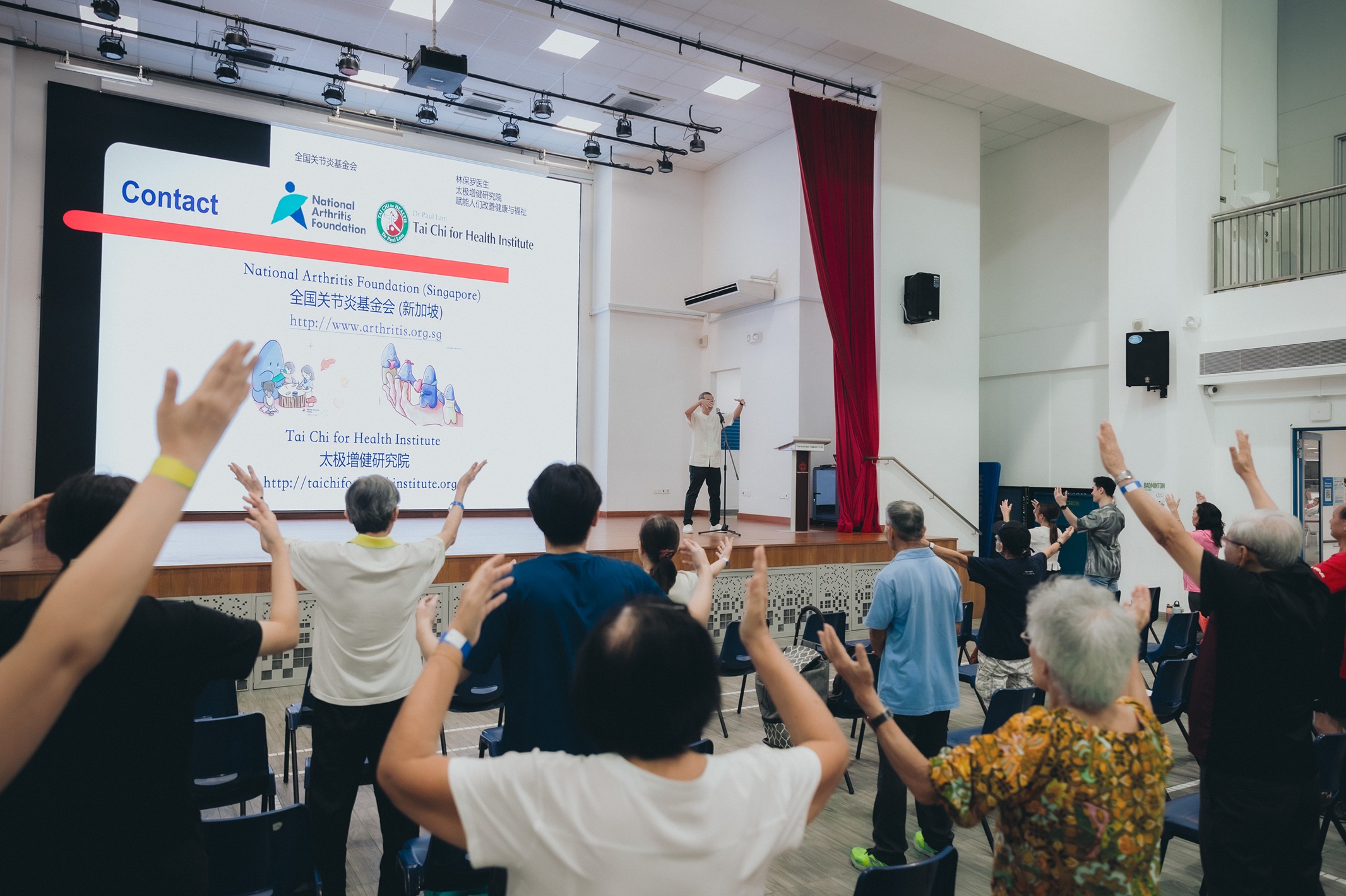 Eager participants learning simple Tai Chi moves from Adjunct Professor Lau Tang Ching (Senior Consultant, Division of Rheumatology and Allergy, Department of Medicine, National University Hospital)